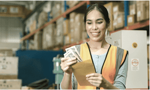 employee with cash and an envelope